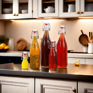 <span class=keywords><strong>Precio</strong></span> de fábrica, botella de agua de leche de jugo de bebida de vidrio redondo transparente vacía con tapa abatible - Product Image 2