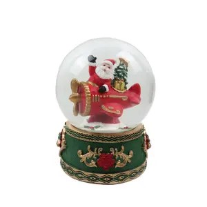 Resin crafts Christmas souvenirs customized snow ball resin souvenir custom globe with Christmas Santa Claus and plane