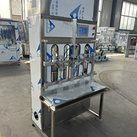 Machine de remplissage de boisson semi-automatique à quatre têtes pour bouteilles de vin et de jus de sauce soja vinaigre bas prix 220V