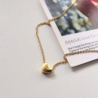 eManco 10PCS Collier mini cœur délicat en acier inoxydable avec petit cœur central, chaîne superposée, ras-de-cou pour femmes