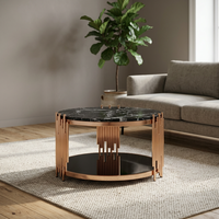 Table basse ronde de style indien et italien avec plateau en marbre et structure en métal finition cuivre, mobilier contemporain pour salon