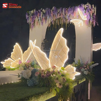 Vente en gros de lumières LED géantes en forme de papillon pour la décoration de routes, couleur blanc chaud, décoration de scène pour mariage