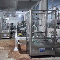 Machine de remplissage à pompe à engrenages à 2 têtes et laveuse de bouteilles à air à 6 têtes pour remplissage d'eau de 5 gallons