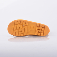 Bottes de pluie pour enfants de couleur rouge-orange avec des imprimés d'animaux, imperméables et dotées d'une boucle de transport