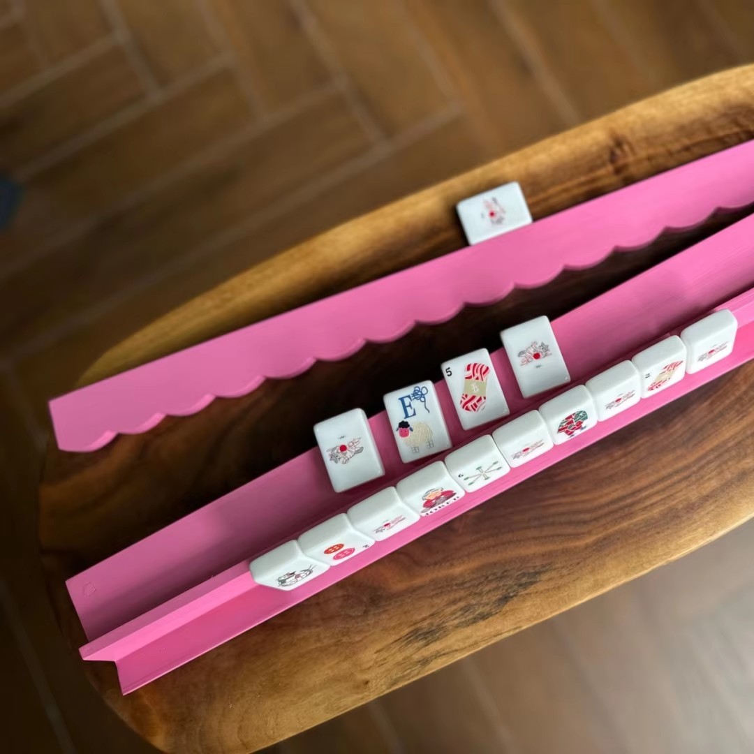 2 poussoirs en bois rose vif