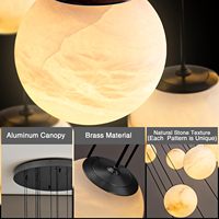 Lustre moderne en marbre noir Senfey avec hauteur réglable, luminaire de luxe pour escalier et hall d'entrée