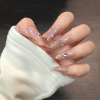 24 faux ongles en ABS à presser, couleur rose nude, motif papillon et strass, forme amande moyenne, réutilisables, design rêveur et doux