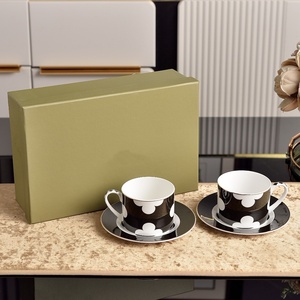 Juego clásico de taza y platillo de porcelana china blanca y negra para té de la tarde, ideal para regalo. - Product Image 1
