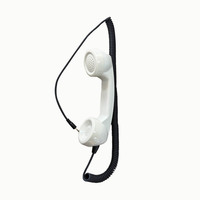 Combiné téléphonique public avec cordon métallique spiralé