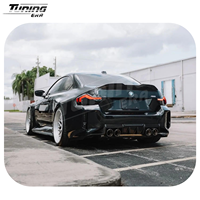 Kit carrosserie en fibre de carbone style R4 pour BMW M2 G87, comprenant lèvre avant, diffuseur arrière, jupes latérales et aération style AP - Vente chaude