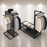 Présentoir de vêtements en treillis métallique noir avec double tringle de suspension et étagères en maille, modèle îlot, vente en gros