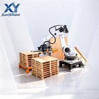 Système de pose de clous sur palettes en bois automatique robotisé à double station, haute efficacité, personnalisable, avec cellule robotique PLC servo-électrique