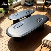 Table basse ovale haut de gamme en placage de bois noir avec incrustation de marbre pour la décoration intérieure de villas de luxe