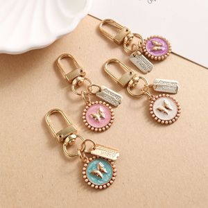 Nouveau <span class=keywords><strong>porte</strong></span>-clés en forme d'arc, étui de protection pour écouteurs Bluetooth, boîte à bijoux, pendentif, petit cadeau <span class=keywords><strong>porte</strong></span>-clés - Product Image 3