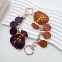 Pochette porte-bonheur best-seller en cuir véritable, pendentif fait main, porte-clés décoratif simple, accessoire de sac au design mignon, nouvelle tendance