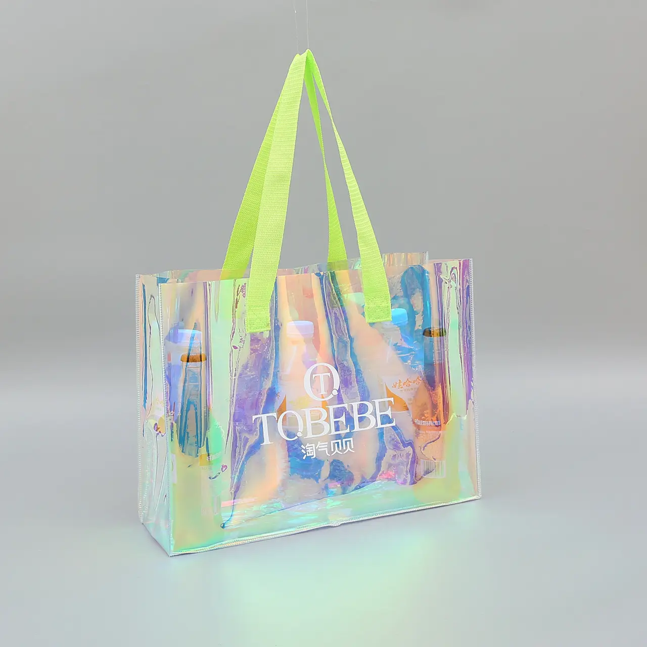 Sıcak satış PVC su geçirmez alışveriş çantası renkli lazer plastik şeffaf çanta özel baskılı logo MOQ100 PVC alışveriş çantası