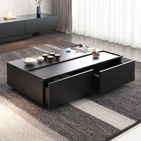 Table basse noire à profil bas avec plateau extensible et grand espace de rangement