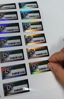 Autocollant holographique VOID personnalisé en gros, résistant à la chaleur et imperméable, pour marque privée