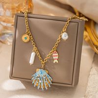 Collier en acier inoxydable plaqué or 18 carats sur le thème de l'océan, pendentif étoile de mer, perle, coquillage, design étoile pour femme - Cadeau, usage quotidien
