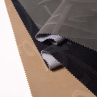 Tissu en similicuir PU à surface lisse, durable et résistant à l'abrasion pour costumes et tenues pour femmes et hommes