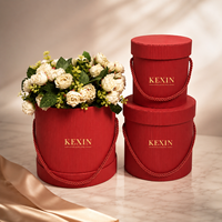 Boîte à fleurs ronde en carton ondulé de luxe personnalisée Kexin avec poignée en corde, emballage cadeau floral haut de gamme avec gaufrage et laminage mat