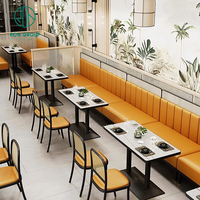 Ensemble de meubles de restaurant de restauration rapide moderne et luxueux, avec canapé en pierre frittée carrée, cuir orange, table et chaises