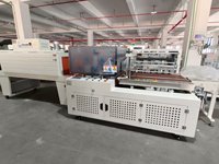 Machine d'emballage automatique à film rétractable avec scellage latéral