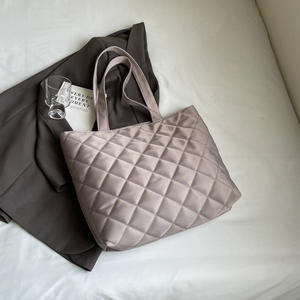 Fashionable tote bag for women in light grey with pleated texture and <b>bow</b> design - Product Image 1