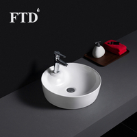Élégant Lavabo de Salle de Bain Rond en Céramique pour Projet Hôtelier Moderne avec Robinet Monotrou et Fonction Lavage des Mains
