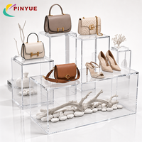 Présentoir en acrylique transparent OEM ODM, ensemble de supports surélevés en plexiglas pour bijoux, chaussures, sacs à main, cosmétiques et montres en magasin de détail