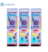 Zormen Máquina de grúa de una sola garra mini con diseño de mapache, gabinete luminoso, operada con monedas, juego de venta sorpresa para fiestas