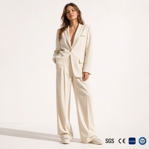 Ensemble <span class=keywords><strong>tailleur</strong></span> <span class=keywords><strong>pantalon</strong></span> femme en gros, coupe décontractée et ample, blazer à revers crantés, <span class=keywords><strong>pantalon</strong></span> large, couleur unie, respirant, style California Creative - Product Image 1