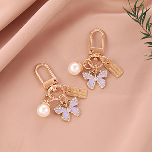 พวงกุญแจ<span class=keywords><strong>ผีเสื้อ</strong></span>ไข่มุกน่ารัก ของขวัญสำหรับผู้หญิง จี้ห้อยกระเป๋า พวงกุญแจรถยนต์ อุปกรณ์เสริมจี้โลหะผสมรูปผีเสื้อ - Product Image 5