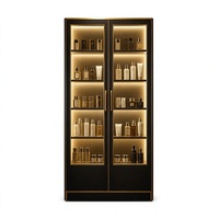 Vitrine de présentation de cosmétiques à double porte en or noir avec étagères en verre rétroéclairées par LED, vitrine de vente au détail de produits de beauté sur pied