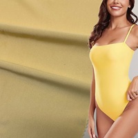Tissu de maillot de bain en maille warp brillante extensible dans les quatre sens en polyester et élasthanne pour vêtements de sport et maillots de bain athlétiques