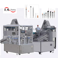 Machine de production de seringues jetables pour perfusion IV Machine d'injection de ligne de montage entièrement automatique