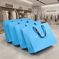 Sac en papier de luxe ivoire en carton robuste avec logo personnalisé pour vêtements
