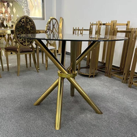 Table à manger ronde en verre en acier inoxydable doré avec pieds croisés, mobilier d'hôtel moderne