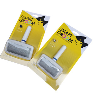 Cepillo de aseo inteligente para perros y gatos con mango blanco, peine de plástico, diseño práctico para uso diario - Product Image 1