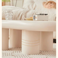 Table basse moderne en bois d'ingénierie blanc en forme de nuage, au design tendance pour salons, salles à manger et espaces extérieurs