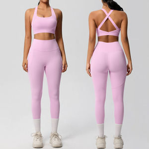 Conjunto de Yoga de 2 Piezas Sin Costuras Para Mujer Tallas S-XL de Gran Venta Sujetador Deportivo Transpirable con Espalda Cruzada y Pantalones Ligeros de Cintura Alta con Bolsillo - Product Image 1