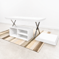 Table de présentation noire avec pieds en X chromés, meuble îlot bas commercial pour vêtements