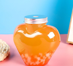 Venta al por mayor, 300ml, 400ml, 500ml, botella <span class=keywords><strong>en</strong></span> forma de corazón de <span class=keywords><strong>amor</strong></span>, botella de jugo de PET, botella de bebidas de agua vacía con tapas para negocios - Product Image 1