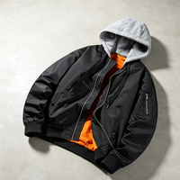 Blouson bomber décontracté noir pour homme avec capuche tricotée amovible, patchwork, doublure intérieure orange écologique, poignets côtelés et poches zippées