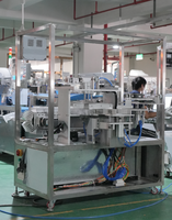Machine automatique de tri et d'emballage pour sachets de granulés