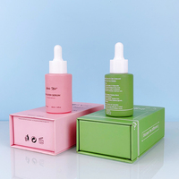 Unique 30 ml 20ml Cheveux Corps Huile Pour Le Visage Bouteille De Sérum Cylindre Rose Flacon compte-gouttes En Verre avec Boîte Plat En Forme D'épaule