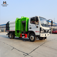 Camion benne à ordures HEAVSTY 7CBM en aluminium avec compartiment à volet roulant et élévateur de déchets 240L 4x2 pour Dongfeng D6 CLW5049ZZZ6