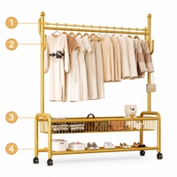 Porte-vêtements métallique robuste en acier au carbone, personnalisable OEM/ODM, vente directe usine pour présentation en magasin de vêtements