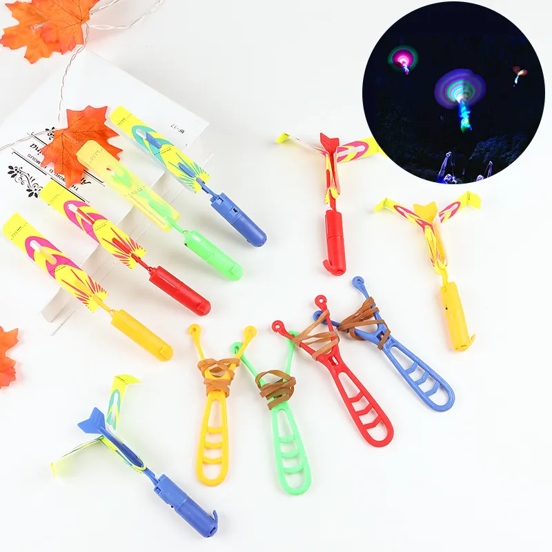 Wholesale Helicopter Faery Flying Toy with LED Arrow Light for Children Outdoor Playing Elastic Powered Slingshot Toy Set