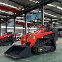 Mini-chargeuse sur chenilles SMT-V1000 avec moteur diesel 25 CV et godet 4-en-1 pour le renouvellement du sol et les travaux de plantation en serre